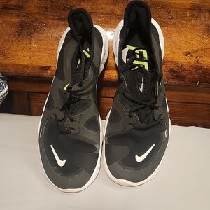Black Nike Free running shoes, women's size 7.5